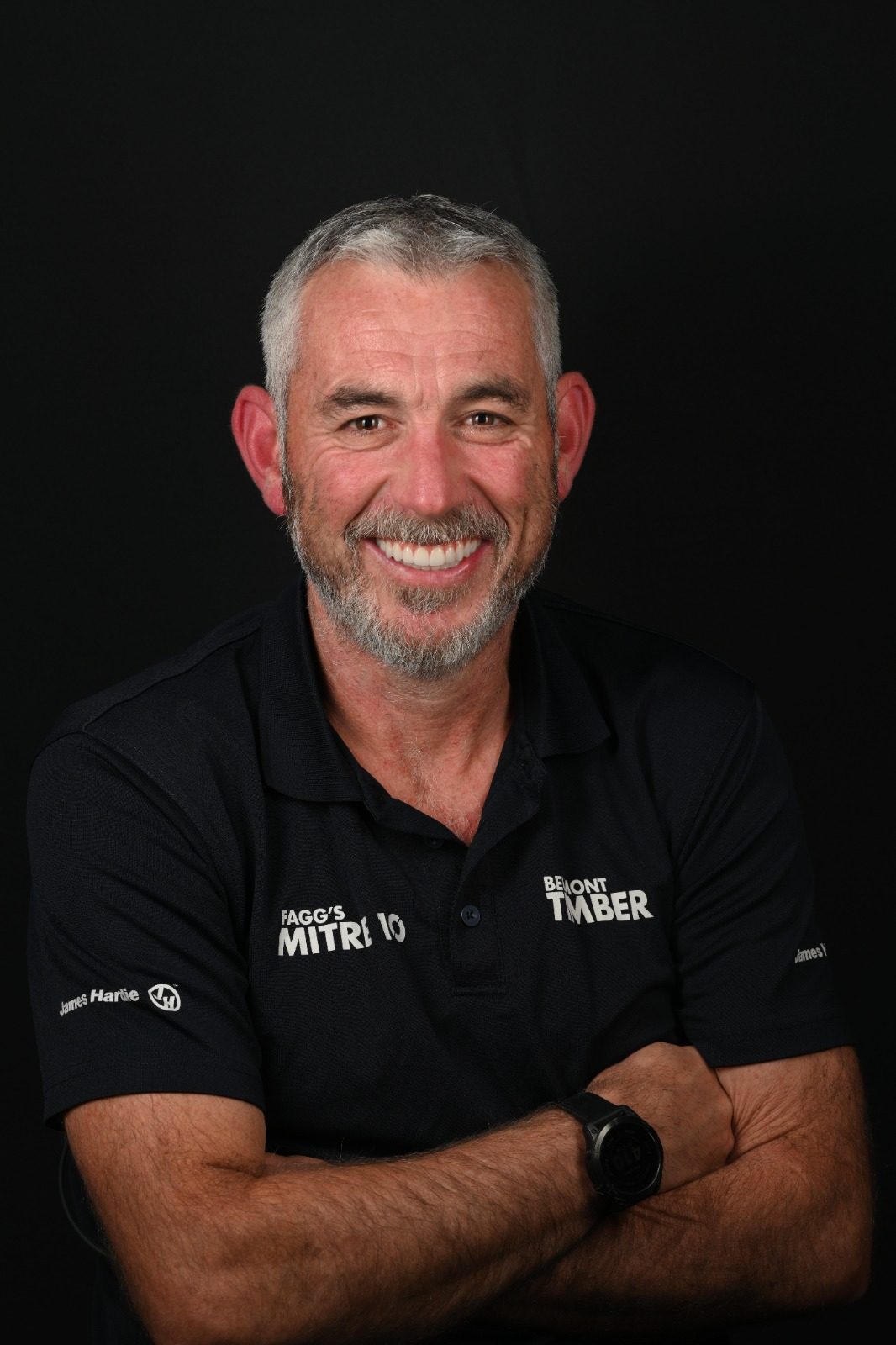 A man smiling warmly with confidence